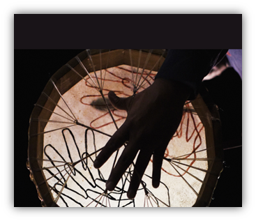 A hand on a Indigenous drum